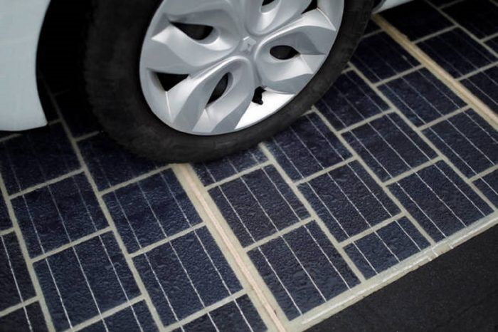 the-tyres-of-an-automobile-are-seen-on-a-solar-panel-road-during-its-inauguration-in-tourouvre-normandy-northwestern-france-december-22-2016-reuters-benoit-tessier